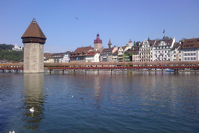 Lucerne small group walking tour and Lake Cruise from Zürich - Kornmarkt and Hotel des Balances frame the old town